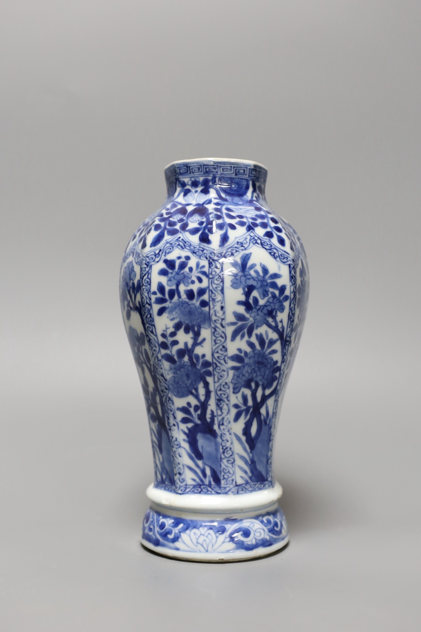 A Chinese blue and white vase, Kangxi period, 23 cms high